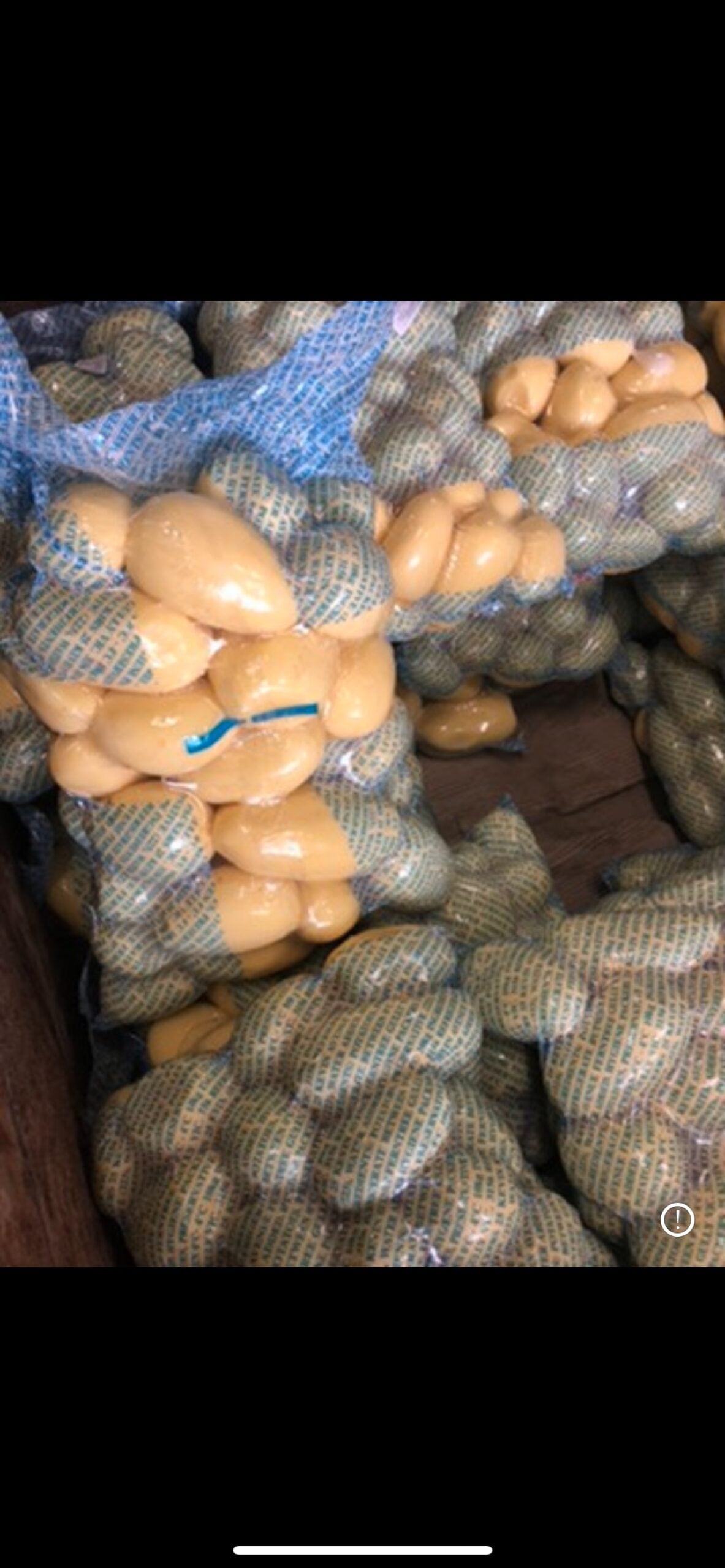 Bags of potatoes stacked high